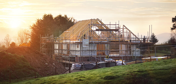 Exercising Your Right to Build House build. House with roof rafters showing and scaffolding