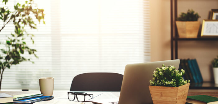 Tips For Organising Your Home Office to Boost Productivity Home Office with glasses and laptop